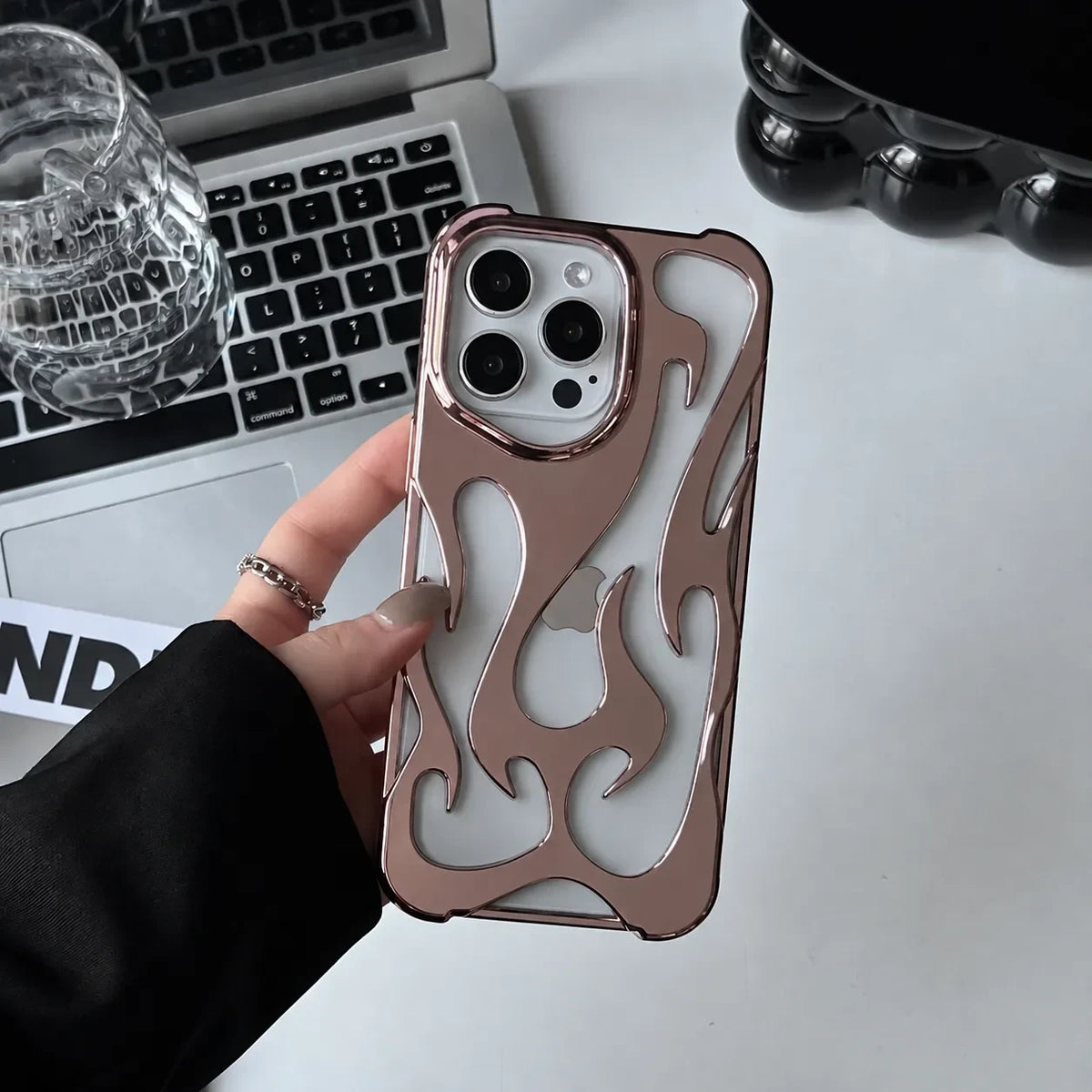 Zelpora bronze chrome flame iPhone case with a translucent frosted finish and raised metallic detailing