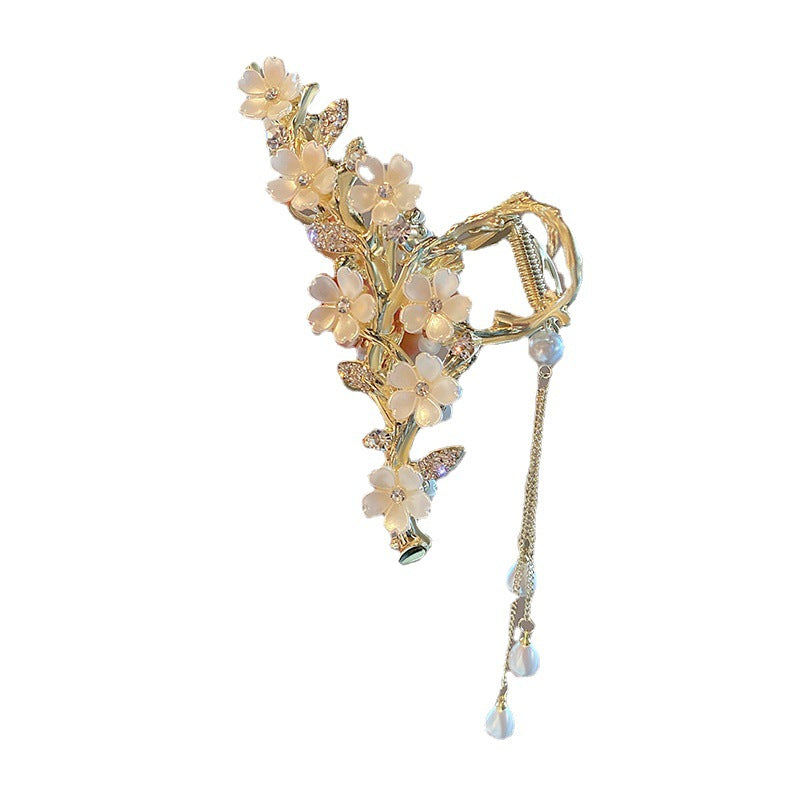 Zelpora gold-tone orchid hair clip with delicate pearl flowers and elegant cascading pearl tassels