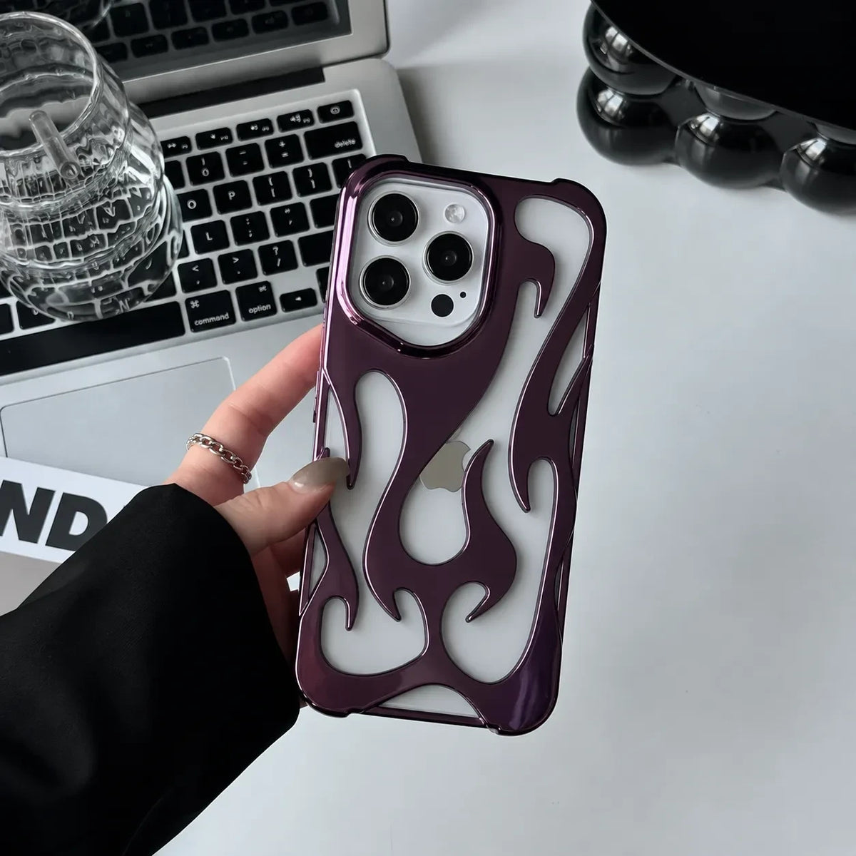 Zelpora plum chrome flame iPhone case with a translucent frosted finish and raised metallic detailing